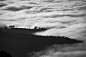 photo of mountain surrounded with sea of clouds