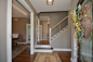 Example of a mid-sized transitional wooden straight cable railing staircase design in Other with painted risers