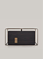 Shakedesign_Night systems_Frame chest of drawers with three drawers, T150 noir, light bronze metal structure, top with leather P36 med col. 1, burnished brass handles