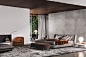 Rust colored accents are modern and lush in this spacious bedroom.