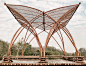 two large wooden structures made out of logs