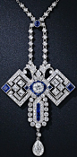  Art Deco Diamond and Sapphire Butterfly Pendant Necklace, circa 1920s. The "wings" are comprised of 6radiant and sizable French-cut diamonds and a pair of square sapphires. The head centers on a bright European-cut diamond framed in electric bl