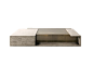 This may contain: a concrete coffee table with an open shelf