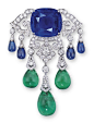 Lot 1780 – A SAPPHIRE, EMERALD AND DIAMOND PENDENT NECKLACE:BROOCH, BY CARTIER