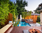 Example of a trendy backyard rectangular pool design in Melbourne with decking