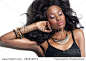 Beautiful African fashion model with long lush hairstyle and makeup. African beauty and golden jewelry.