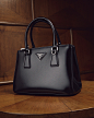 Photo by Prada on December 23, 2020. May be an image of purse, saddle-stitched leather and text that says 'PRADA O'.