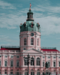 White and Red Concrete Building With Tower