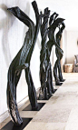 | FOYER | Haunting, sculptural trees fill this foyer in Luxury chalet No.14, Verbier, Switzerland. Designed by Fiona Barratt Interiors.