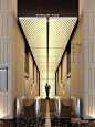 great textural light tray that could wrap around the tunnel into the elevator lobby. Needs something strong to lead the eye