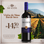 其中可能包括：a bottle of san severo wine sitting on top of a table next to a vineyard