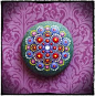 Elspeth McLean putting the finishing dot on a mandala stone #mandalastone #elspethmclean #dotillism | ROCKS | Pinterest | Mandalas, Dots and Stones