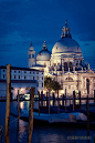 The Church of Santa Maria della Salute from across the Grand Canal at night in Venice