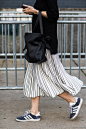 Black jumper, stripe midi skirt, black bag + blue Adidas Gazelle trainers | @styleminimalism: 