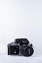 black Nikon camera against white background