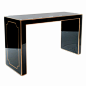 black glass console with gilded accents