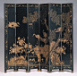 Coromandel Paravent in Black Lacquer with carved birds and foliage and painted with gold leaf