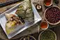 A woman is giving zongzi(rice dumpling) to others as a present on Dragon Boat Festival, Asian traditional food,A woman is giving zongzi(rice dumpling) to others as a present on Dragon Boat Festival, Asian traditional food,