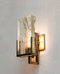 Brass + glass sculptural wall light.