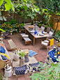An eclectic mix of seating areas makes up this outdoor retreat tucked behind Brooklyn's busy streets. The terraced brownstone backyard is the perfect gathering space for family and friends.: 