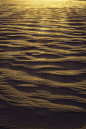 Landscape shot of the desert and the wind pattern on the sand, full frame