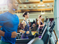 Smiling man running on treadmill at gym by Caia Images on 500px