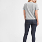 The Cotton Box-Cut Pocket Tee : A gamine box cut tee made from the softest lightweight cotton we could find. The roomy cut is cropped to sit right above the hip. It features a boyish crew neck and pocket detail, and the fabric is a combed cotton that gets