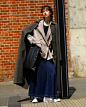 Photo shared by CLUÉLmagazine on October 11, 2023 tagging @sacraofficial. May be an image of 1 person, duffle coat and overcoat.