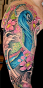 peacock arm sleeve tattoo.