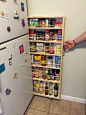 Hidden Fridge Gap Slide-Out Pantry . I would make this taller. If you're worried about heat, you could make it into a lid rack!: 