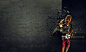 Young boxer woman. Young boxer woman breaking concrete wall with kick_创意图片