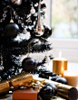 3867096-black-christmas-tree-with-silver-and-black-balls-and-gold-candles-and-crackers