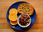 Orange slices and rye toast with peanut butter and raw pumpkin seeds. Plain soy yogurt topped with pumpkin flax granola, pomegranate seeds and pumpkin seeds.