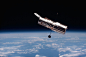 a satellite in the air above the earth
