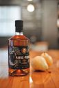 Long Table Distillery has a limited batch of the spirit, and they turned to David Arias for a design that would tell a bit of the story of how it came to be and give you a sense of the delightful flavor inside.