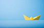 closeup photo of yellow paper boat