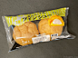 a package of yam maker buns with an orange peel in the middle on a table