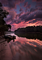 A passing storm lights up at sunset over the Wabash River at Fort Ouiatenon in West Lafayette