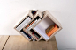 What desk doesn’t need more storage? The Drap shelf by Russian designer and craftsman Vladimir Soveng is a beautiful way to add useful storage to any workstation of any style and size. Its inventive shape allows you to accommodate various items – papers, 