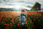 My daughter (4 years old) running into the poppy-field. For me this photo is an expression of exactly the way those little people are... they feel free, they are able to enjoy mother nature in a way we have forgotten long time ago... so it makes me very h