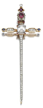 A GEM-SET AND DIAMOND BROOCH, CIRCA 1900. Designed as a sword, the pommel and grip accented with circular-cut rubies, a cabochon tourmaline, highlighted with single- and circular-cut diamonds, the cross-guard centring on a pearl measuring approximately 9.