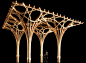 three wooden structures are shown against a black background