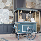 Fancy French Ice cream cart.  Cart sits on side walk like its a store.