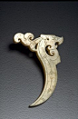 Dragon-shaped pendant (xi), China, Warring States Period (approx. 480-221 BCE). Nephrite. H. 1 1/8 in x W. 2 3/8 in x D. 3/16 in, H. 2.9 cm x W. 6 cm x D. .5 cm. The Avery Brundage Collection, B60J795 © 2017 Asian Art Museum Chong-Moon Lee Center for Asia