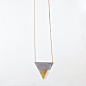 This concrete triangle necklace is a perfect architectural statement piece. Each piece is individually hand molded, sanded, cured for a week, then: 