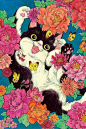 Black and white cat frolicking in flowers