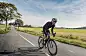Cyclist Out On a Training RidePortrait of a fit 50 year old male cyclist out of a training ride. Photographed in a modern contemporary style, colour, horizontal with some copy space. Photographed on the island of Møn in Denmark.