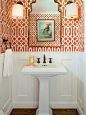 Small trendy dark wood floor and brown floor powder room photo in Denver with a pedestal sink, orange walls and a two-piece toilet