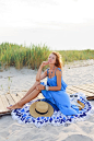 Free photo outdoor summer image of romantic  woman relaxing on sunny beach in blue dress.