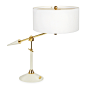 Jonathan Adler Maxime Task Table Lamp : Mad Men Meets Holly Golightly.A slim, brass stem with an ivory lacquered cone base, drum shade, and signature arrow sabot. Complete with a perforated brass diffuser, our Maxime Task Table Lamp casts a soft golden gl